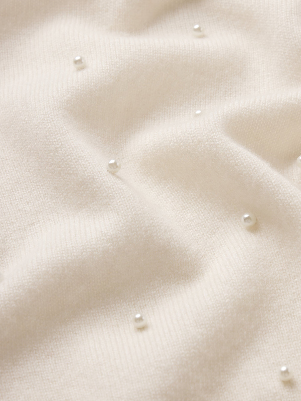 FRAME Cream Pearl Cardi fabric close-up